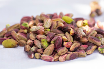 Sweet, delicate and fragrant nuts, Bronte pistachios with  brilliant green colour, ingredient for Italian cuisine, ice creams, cakes, pesto