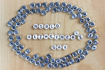 World Alzheimer's Alzheimer's Day of plastic letters on a wooden background