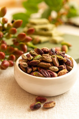 Sweet, delicate and fragrant nuts, Bronte pistachios with  brilliant green colour, ingredient for Italian cuisine, ice creams, cakes, pesto