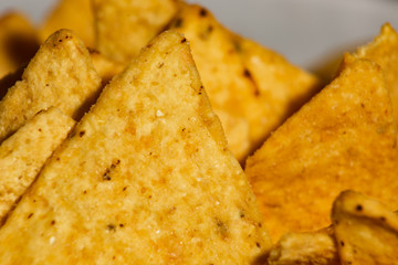 Background of triangular nachos is close