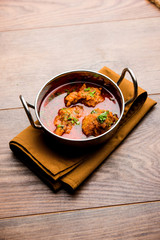 Lauki Kofta Curry made using Bottel Gourd or Doodhi, served in a bowl or karahi. selective focus