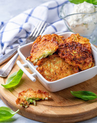 Zucchini fritters with sour cream sauce.