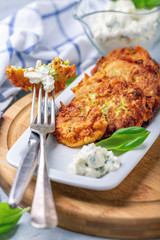 Plate with fritters from zucchini.