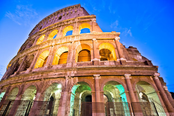 Fototapeta premium Majestic Colosseum of Rome evening colorful view