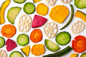 Dried vegetables chips on white background