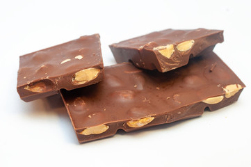 Chocolate with nuts isolated on white background