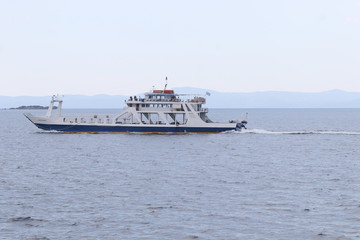 AMMOULIANI, HALKIDIKI, GREECE - JULY 13, 2019: Landscape with Ferry port for Ammouliani island,...