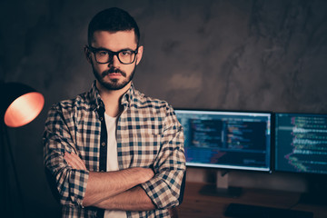 Portrait of confident brunet bearded guy ceo boss chief company founder professional expert specialist behind screen digital cyber security at wooden industrial interior work place station - obrazy, fototapety, plakaty