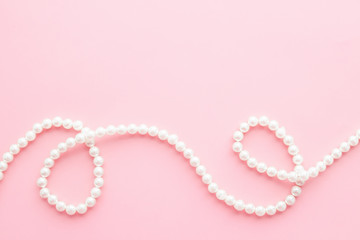 Pearls on pastel pink background - 280198410