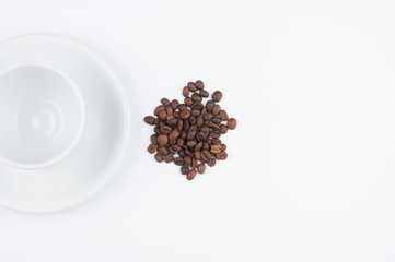 Coffee beans and cup isolated on white background.Copy space