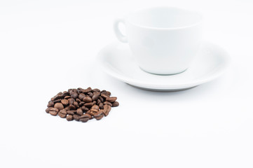 Coffee beans and cup isolated on white background.Copy space