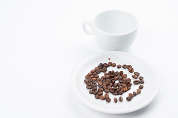 Coffee beans and cup isolated on white background.Copy space