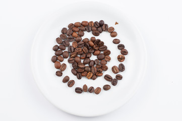 Coffee beans and cup isolated on white background.Copy space