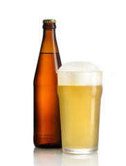 glass of beer and bottle on white background