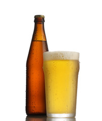 glass of beer and bottle on white background