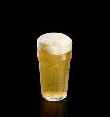 glass of beer on a black background