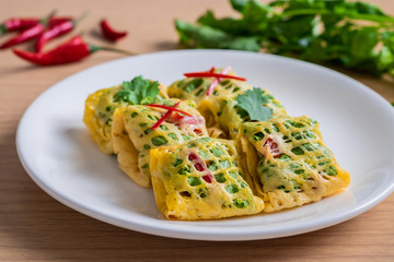 Fried minced pork, prawns, vegetable and nut wrapped in egg net (Latieng), Thai traditional food
