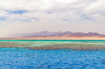Mountain landscape with blue water in the national park Ras Mohammed, Egypt.