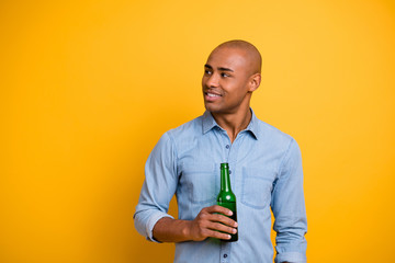Photo of dark skin macho raise hold hand beer bottle listen friends sport bar wear jeans denim...