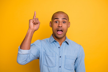 Photo of dark skin macho reliable person got new brilliant idea startup raise finger wear jeans...