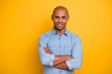 Photo of dark skin macho arms crossed positive mood reliable person wear jeans denim shirt isolated...