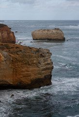 Fototapeta na wymiar Cliffs in the foregrund and in the background in the Bay of Islands area at the Great Ocean Road in Australia