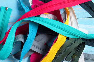 Pack a lot of colorful plastic zippers stripes with sliders pattern for handmade sewing tailoring...