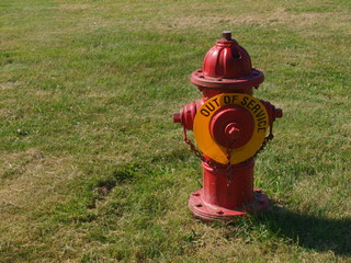 Red fire hydrant with Out Of Service sign no water