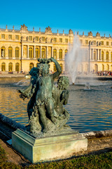Statue and Palace of Versailles on the background, Versailles, France