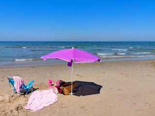 beach umbrella/parasol on the beach on a sunny day