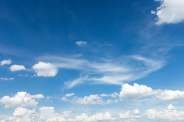 Naklejka na ściany i meble Autumn blue sky background texture with white spindrift very clouds.