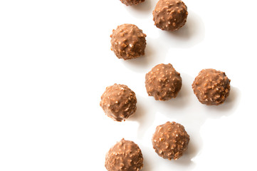 round chocolate candy with nuts on white isolate background