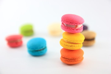 Colorful homemade macaroons on a white background.