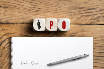 Cubes with acronym PO for product owner on wooden background - obrazy, fototapety, plakaty