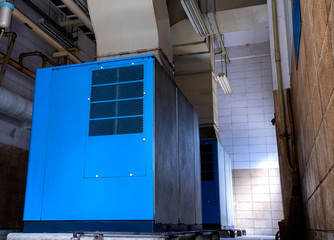 Low light view inside of factory. Low view of the old Machine control room for on - off the large...