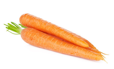 Isolated carrots. Heap of fresh carrots with stems isolated on white background
