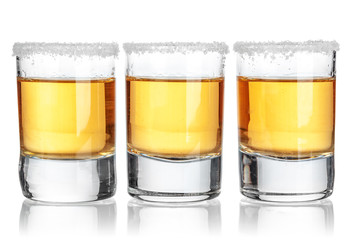 Gold tequila shot  isolated on white background
