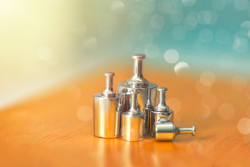 Set of metal weights for scales and the calibration test. Weight set for calibration balance to accuracy and precision. Apothecary, pharmacist, scientist. Physics.