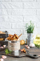 Baked young potatoes in a rustic style with sour cream