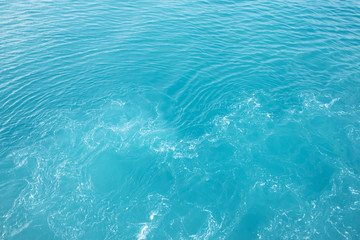 Sea  Waves in ocean wave Splashing Ripple Water. Blue water background.  Leave space to write a...