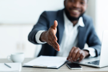 African American businessman extending hand to shake