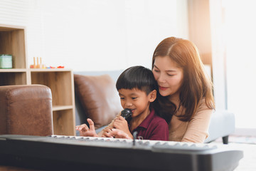 image of happy family at living room,happiness time of family playing at home,Mom and baby are happiness coexistence,happy family concept and Creating activities to strengthen skills for children.