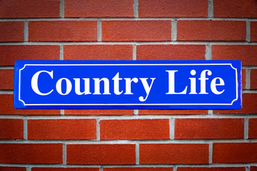 Country Life street sign on brick wall