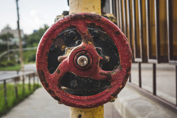 the red valve on the gas pipe.