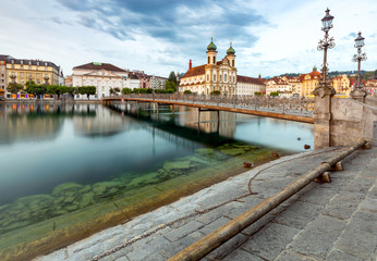 Lucerne. Old city embankment and medieval houses at dawn.