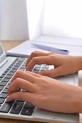 Close-up of typing female hands on keyboard