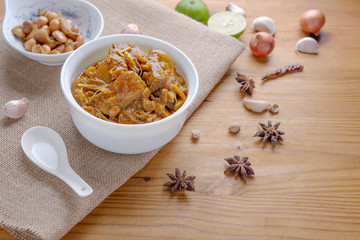 Red curry or Pork curry on wood table soft background, thai food, india food, Thai Food name Hung Ley