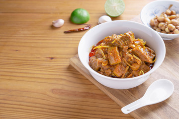 Red curry or Pork curry on wood table soft background, thai food, india food, Thai Food name Hung Ley