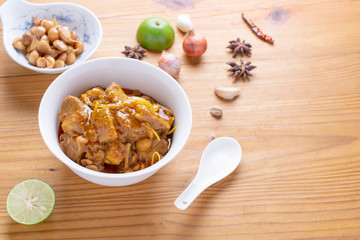 Red curry or Pork curry on wood table soft background, thai food, india food, Thai Food name Hung Ley