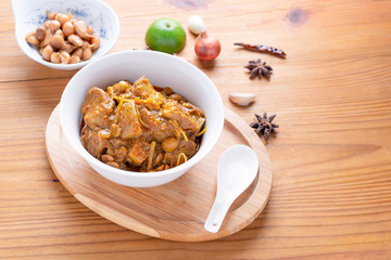 Red curry or Pork curry on wood table soft background, thai food, india food, Thai Food name Hung Ley